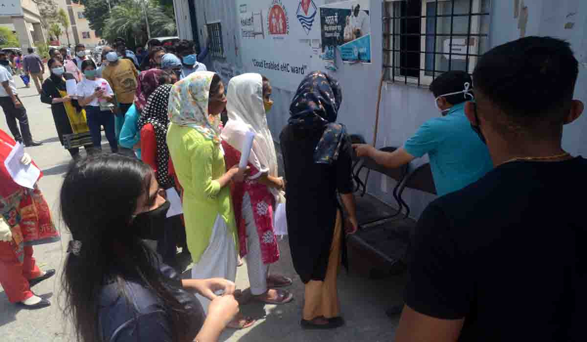 People queue in Coronation hospital in Dehradun