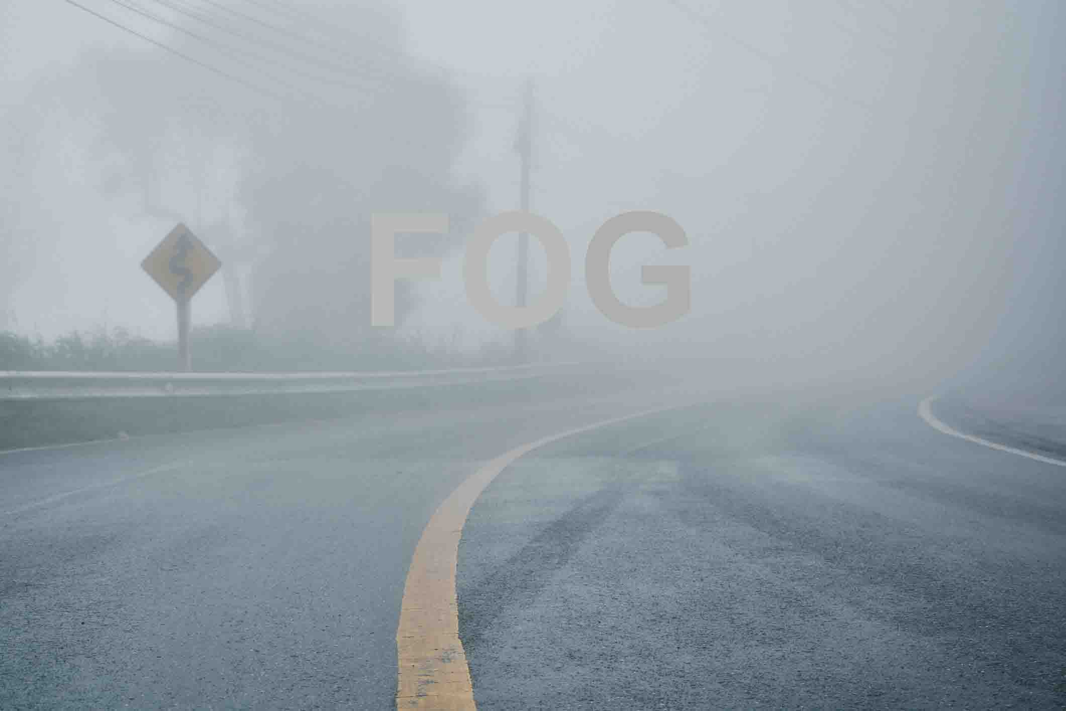 foggy rural asphalt highway perspective with white line, misty road, Road with traffic and heavy fog, bad weather driving