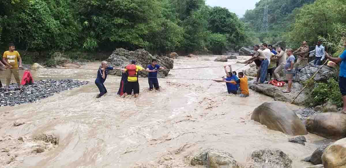 11 rescued after being stranded by swollen river