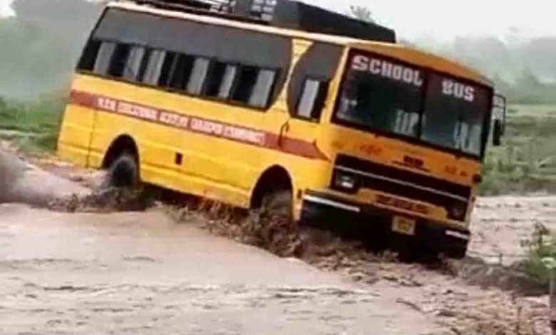 School bus overturns