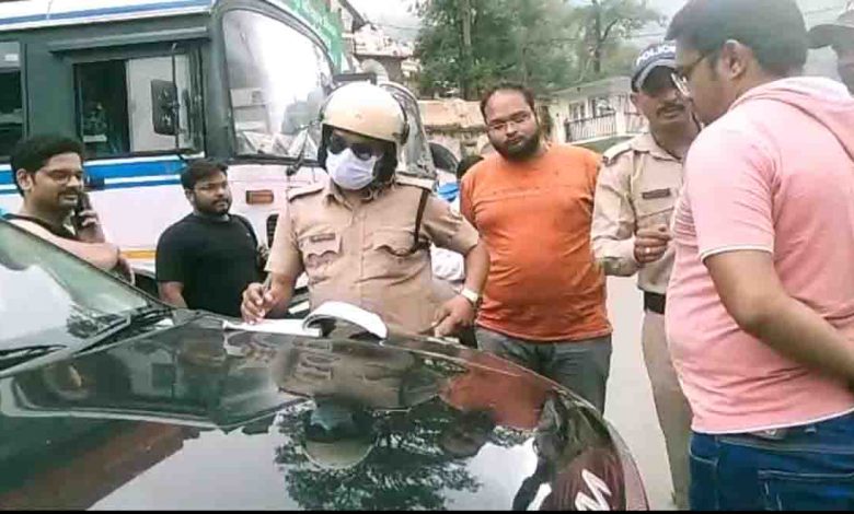 Tourists penalised for filming video atop moving car