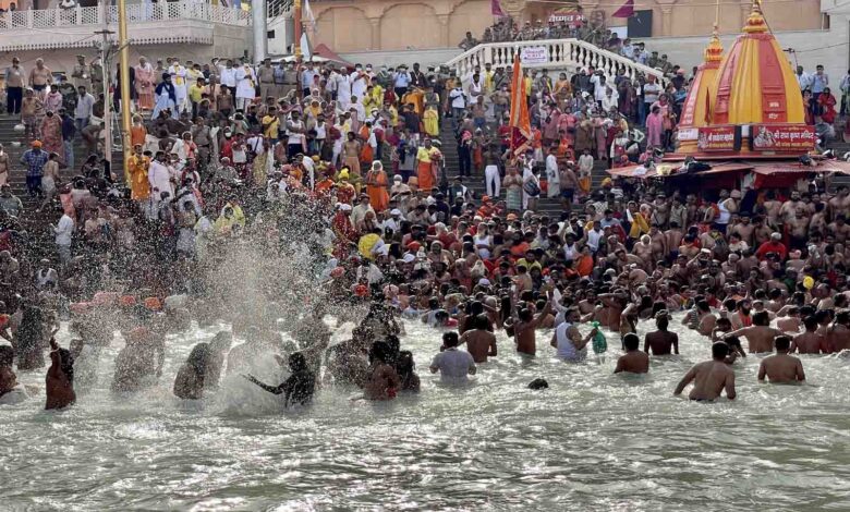 Sadhus bathing at Har Ki Paidi in Haridwar during the 2021 Kumbh