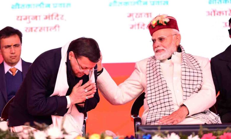 PM Modi pats CM Dhami's back again